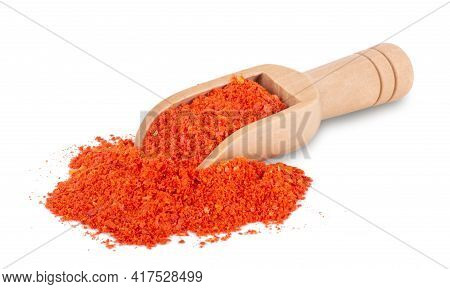 Scoop In Heap Of Red Powder Pepper On White Background