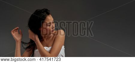 Young Beautiful Asian Half Naked Woman In Bath Towel Tousled Her Hair With With One Hand , Isolated 