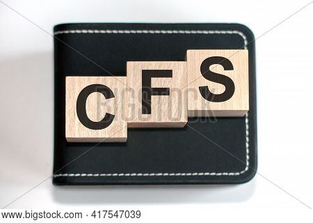 Motivational Words: Cfs In 3d Wooden Alphabet Letters On A Keyboard Background With Copy Space, Busi