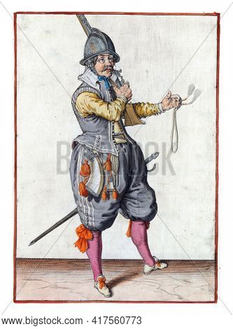 A soldier, full-length, to the right, placing a rudder (a type of firearm) with his right hand on his left shoulder, the barrel pointing up. In his outstretched left hand a burning fuse