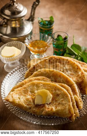 traditional morocco bread wih butter honey and mint tea