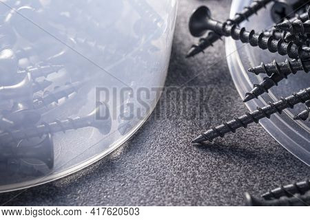 A Handful Of Self-tapping Screws For Wood. Construction Abstraction. Industrial Background.