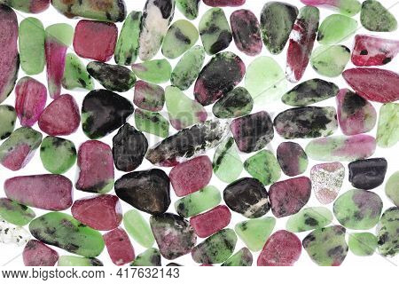 Ruby Zoisite Jewel Stones Heap Texture On Light White Isolated Background