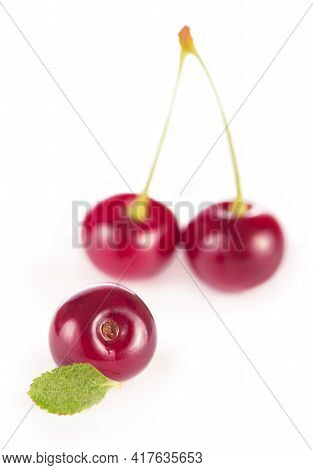Ripe Fresh Red Cherry Isolated On White Background. With Clipping Path.