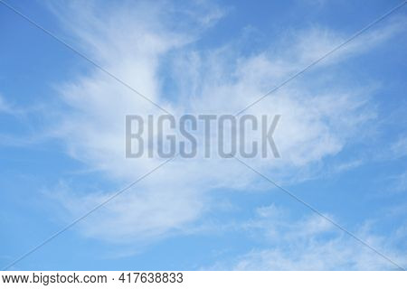 Hello Summer Sky Is Bright Blue. There Are Clouds Floating Through. Feel Relax When Looking. See The