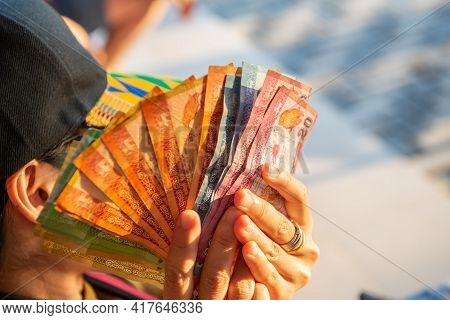 Cropped Shot Of Woman Hand Holding A Group Of Sri Lanka Money In Her Hand. Sri Lankan Rupee Is The C