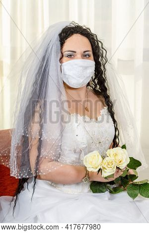 A Jewish Bride Sits Waist-deep In A Synagogue Before A Chuppa Ceremony During A Pandemic, Wearing A 