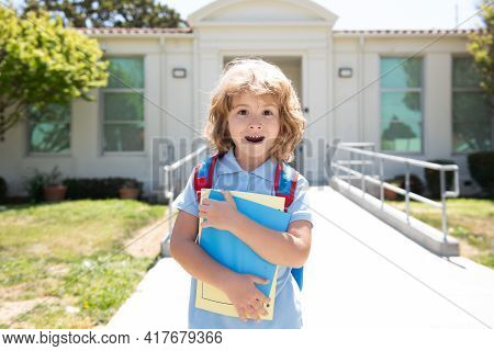 Portrait Of The Amazed American Boy Who Is Going To School With His School Backpack. Back To School.