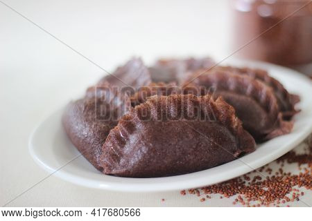 Steamed Dumplings Made From Finger Millet Flour. It Is Stuffed With Coconut And Jaggery To Make It S