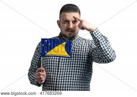 White Guy Holding A Flag Of Tokelau And A Finger Touches The Temple On The Head Isolated On A White 
