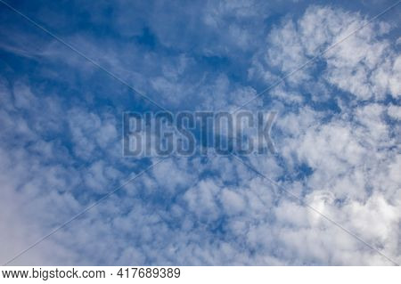Cirrus Clouds On A Sultry Summer Day. A Rare View Of Cirrus Clouds On A Calm Day. Spindrift Clouds. 