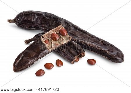 Ripe Carob Pods And Bean Isolated On White Background With Clipping Path And Full Depth Of Field