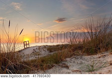 Nice Sunset Colorful Sky, Sea And Dune Grass In The Foreground