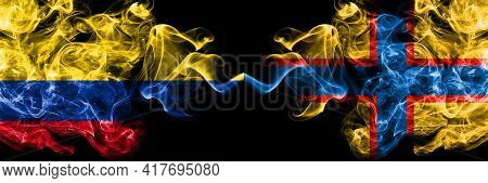 Colombia, Colombian Vs Ingrian People Smoky Mystic Flags Placed Side By Side. Thick Colored Silky Ab