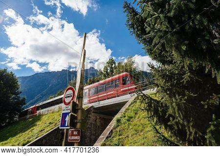 Chamonix, France - Aug 18, 2017: Red Train With Destination Mer De Glace Above Rue Helbronner And Ta