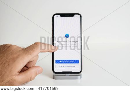Paris, France - Sep 25: Pov Male Hand Touching The New Apple Computers Iphone 13 Smartphone With Run