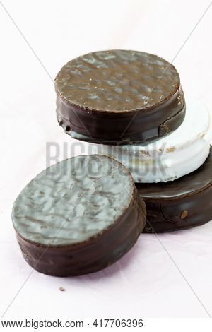 Stacked Chocolate And Meringue Cookie On Background White