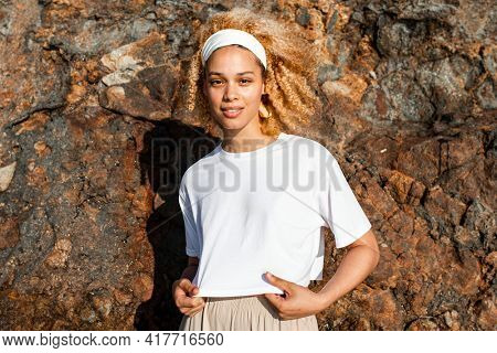 Happy woman in white crop top outdoor photoshoot