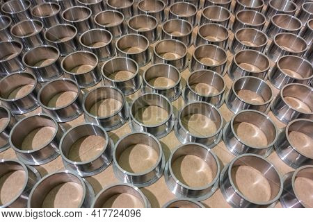 Full Frame Batch Array Of Shiny Steel Cylindrical Sleeve Parts With Flange