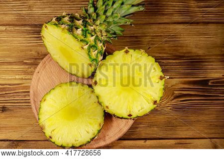 Fresh Pineapple On A Rutic Wooden Table