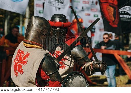 Reconstruction Of Historical Events. Festival Of Jousting Tournaments. Two Knights With A Lion On Th