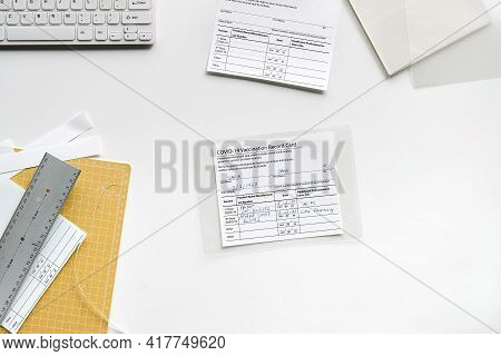 Fake Covid Vaccination Record Card. Covid Scams. Forged Health Certificate With False Vaccination Re