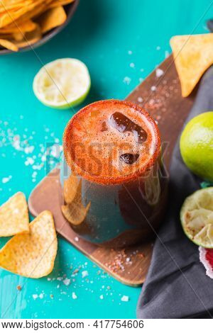 Mexican Alcohol Cocktail Michelada With Dark Beer And Lime Juice