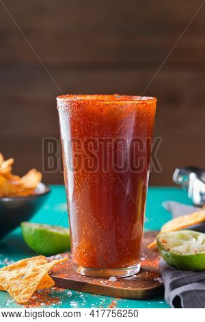 Mexican Alcohol Cocktail Michelada With Dark Beer And Lime Juice