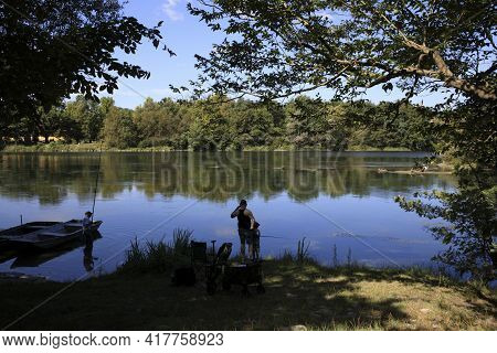 Castano Primo (mi), Italy - June 05, 2017: Fisherman Near Ticino River, Castano Primo, Lombardy, Ita