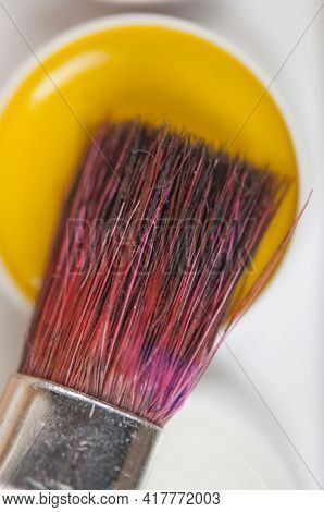 Watercolor paintbox. Color paints with paint brushes. Back to school concept. Kids painting concept. Children art. Top view. Copy space.