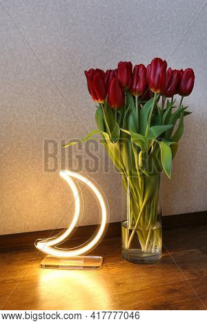 Neon Moon Sign With Beautiful Red Tulips. Trendy Style. Floral Background. Neon Sign. Custom Neon. H