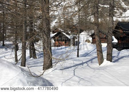 Devero Park ( Verbano-cusio-ossola ), Italy - January 15, 2017: Typical Houses In The Forest At Alpe