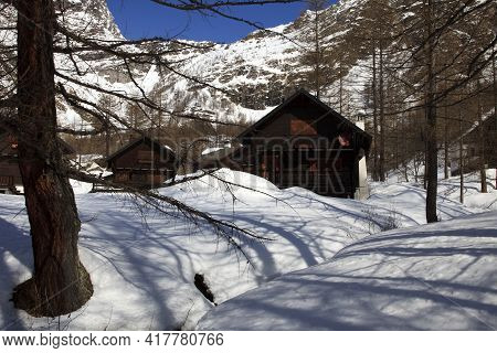 Devero Park ( Verbano-cusio-ossola ), Italy - January 15, 2017: Typical Houses In The Forest At Alpe