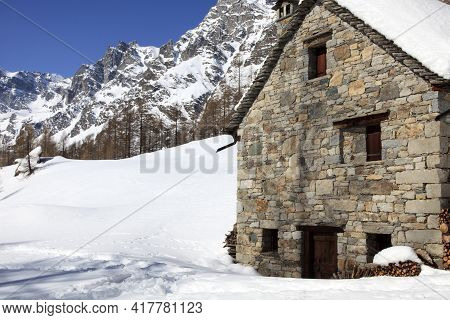 Devero Park ( Verbano-cusio-ossola ), Italy - January 15, 2017: A Stone House At Alpe Devero Park, O