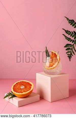 Hard Seltzer Cocktails With Grapefruit And Rosemary. Refreshing Colorful Summer Drink On Pink Backgr