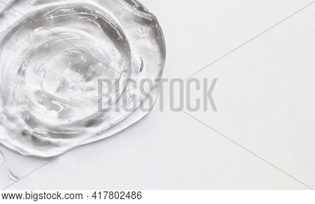Gel Texture Of The Emulsion On A White Background. Clear Cream And Copy Space
