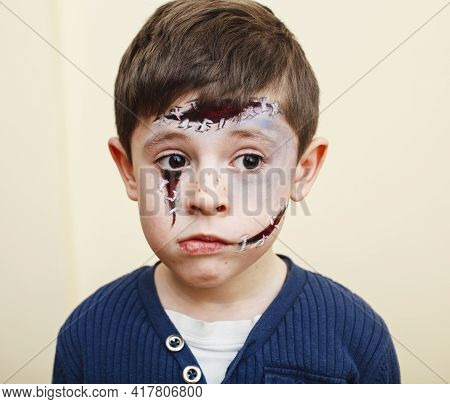 Little Cute Child With Facepaint On Birthday Party, Zombie Apocalypse Facepainting, Halloween Prepar