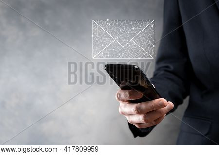Businessman Hand Holding E-mail Icon, Contact Us By Newsletter Email And Protect Your Personal Infor