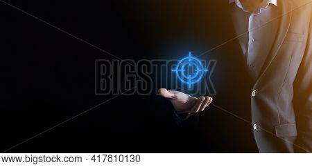 Targeting Concept With Businessman Hand Holding Target Icon Dartboard Sketch On Chalkboard. Objectiv