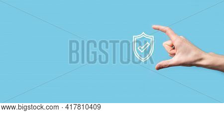 Male Hand Holding Protect Shield With A Check Mark Icon On Blue Background. Protection Network Secur