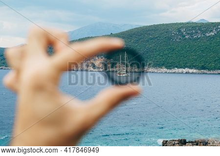 Large Two-masted Yacht Sails On The Sea. Through The Camera Lens. Cpl Polarizing Filter For The Came