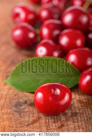 Cherries On Wooden Table With Water Drops Macro Background