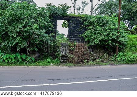 Stock Photo Of Old Collapsed Wall Constructed Using Black Stone Road Side Of Indian Village Area, Pi
