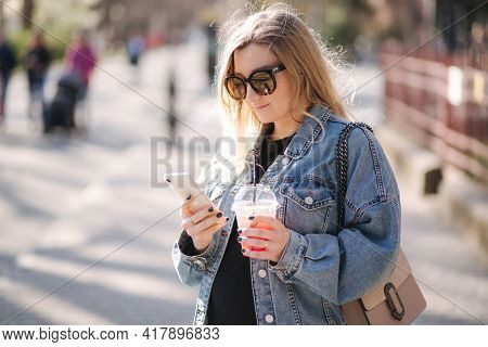Pretty Prengant Woman Dringking Strawberry Lemonade While Walking Outdoors. Portrair Of Attractive F