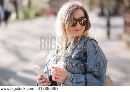 Pretty Prengant Woman Dringking Strawberry Lemonade While Walking Outdoors. Portrair Of Attractive F