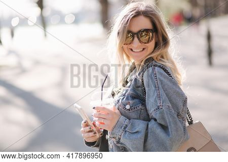 Pretty Prengant Woman Dringking Strawberry Lemonade While Walking Outdoors. Portrair Of Attractive F