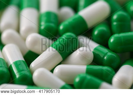Large Number Of Pharmaceutical White-green Tablets Closeup