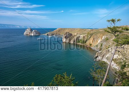 Rocky Bay With Clear Blue Water And Yachts. Stone Island. Unique Nature Of Olchon Island