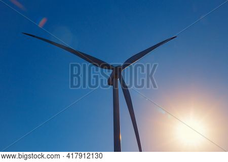 Wind Turbines Against Beautiful Sky. Eolic Park. Eco Farm Of Clean Energy. Green Ecological Power En