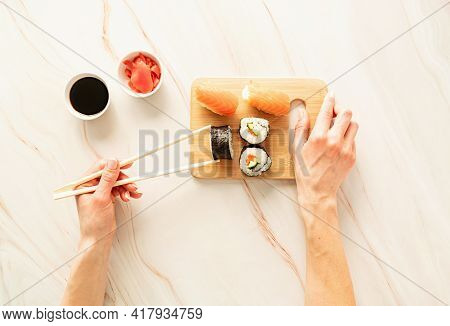 Sushi Salmon Set On Wooden Cutting Board Asian Food On Marble Background, Top View Flat Lay